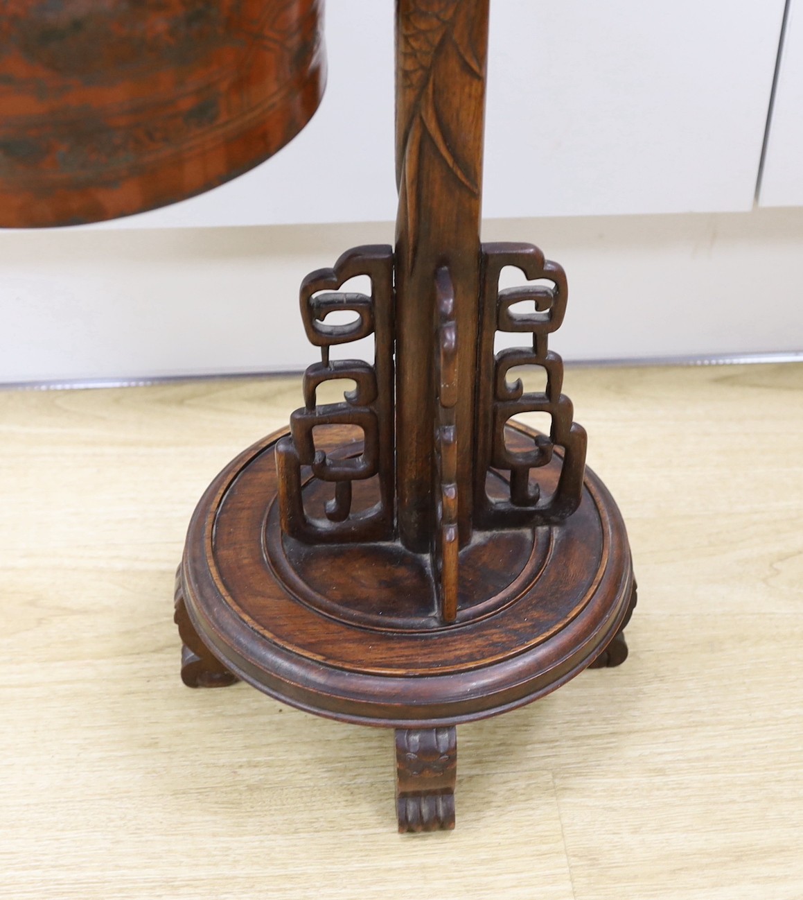 A Chinese carved hongmu 'dragon' stand with Japanese bell, 73cm tall